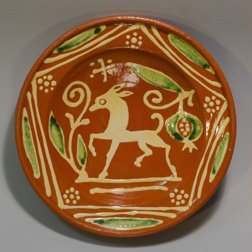 17th century dish  with animal and replica to the left. Picture credit: Angela Mombers