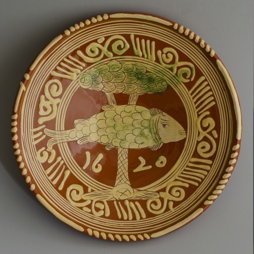 Werra dish with fish and tree dated 1620 and replica to the left