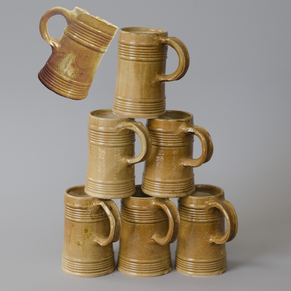 reconstructed  tankards with an original in the left upper corner / 16th century