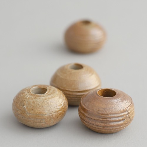 replicas of 16th century spindle whorls