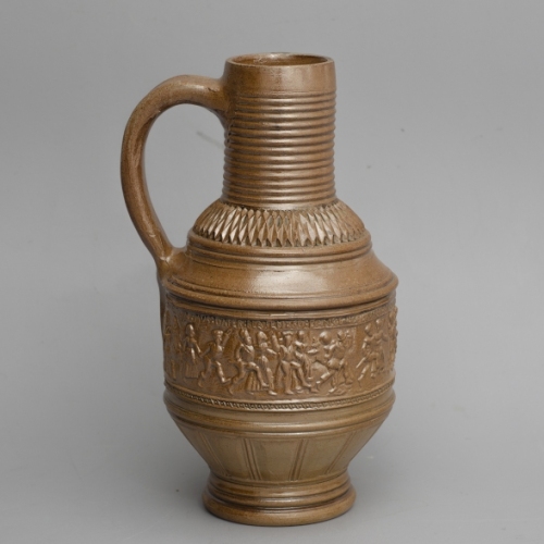 left: replica of a peasant dance jug. Right: late 16th century peasant dance jug made in Raeren and found in Emden