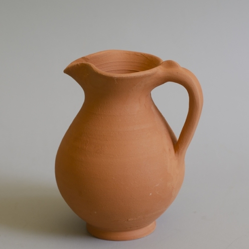 replica redware Roman pitcher from the 1st or second century to the left, the original to the right