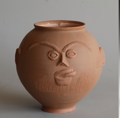 replica of a Roman face pot type Hofheim 26 with the original to the right that was found in Woerden / collection RMO / 40-80 AD